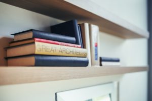 kaboompics.com_Great architects book - wooden shelf